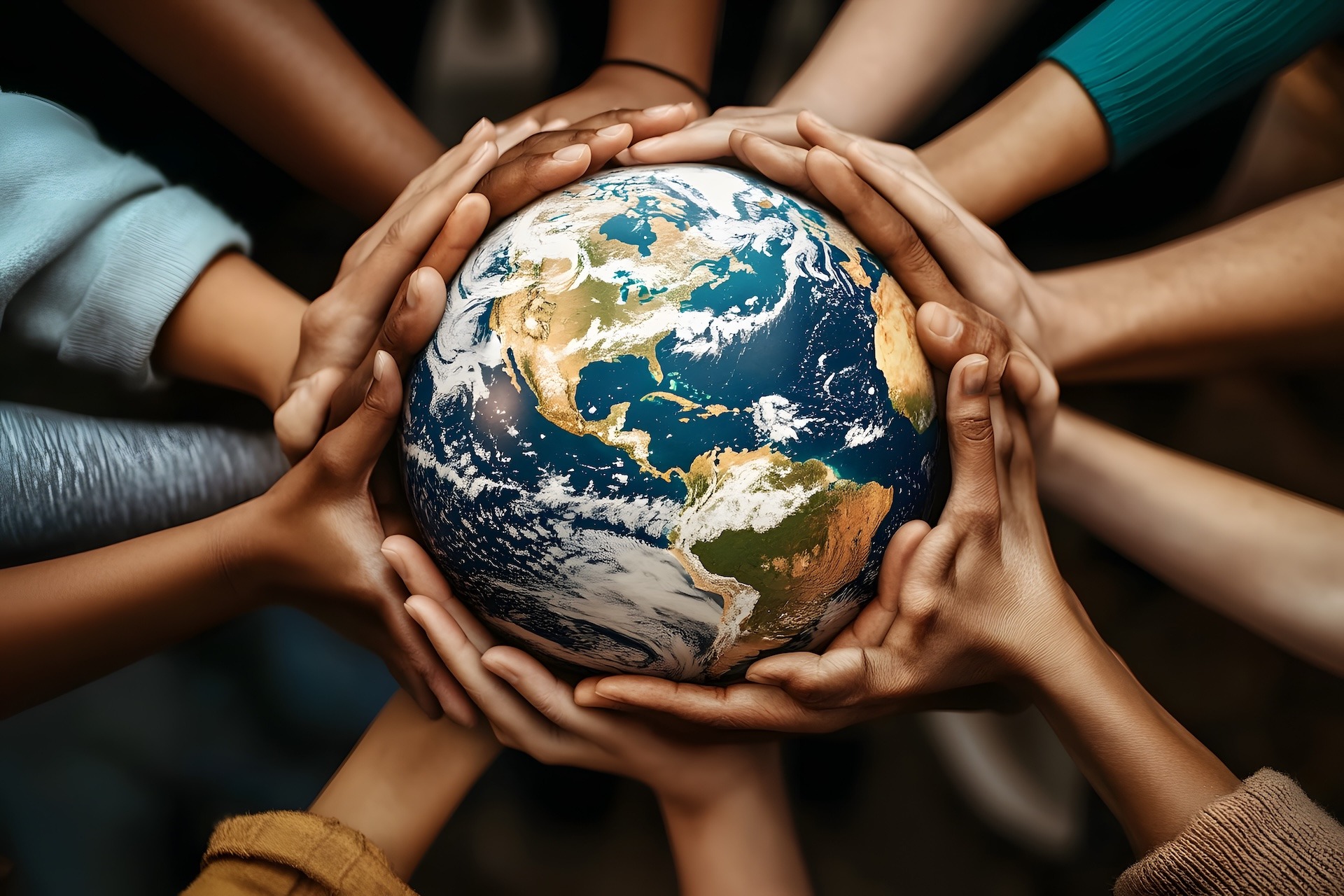 Multiple hands of diverse individuals holding a globe together symbolizing global unity, cooperation, and diversity.